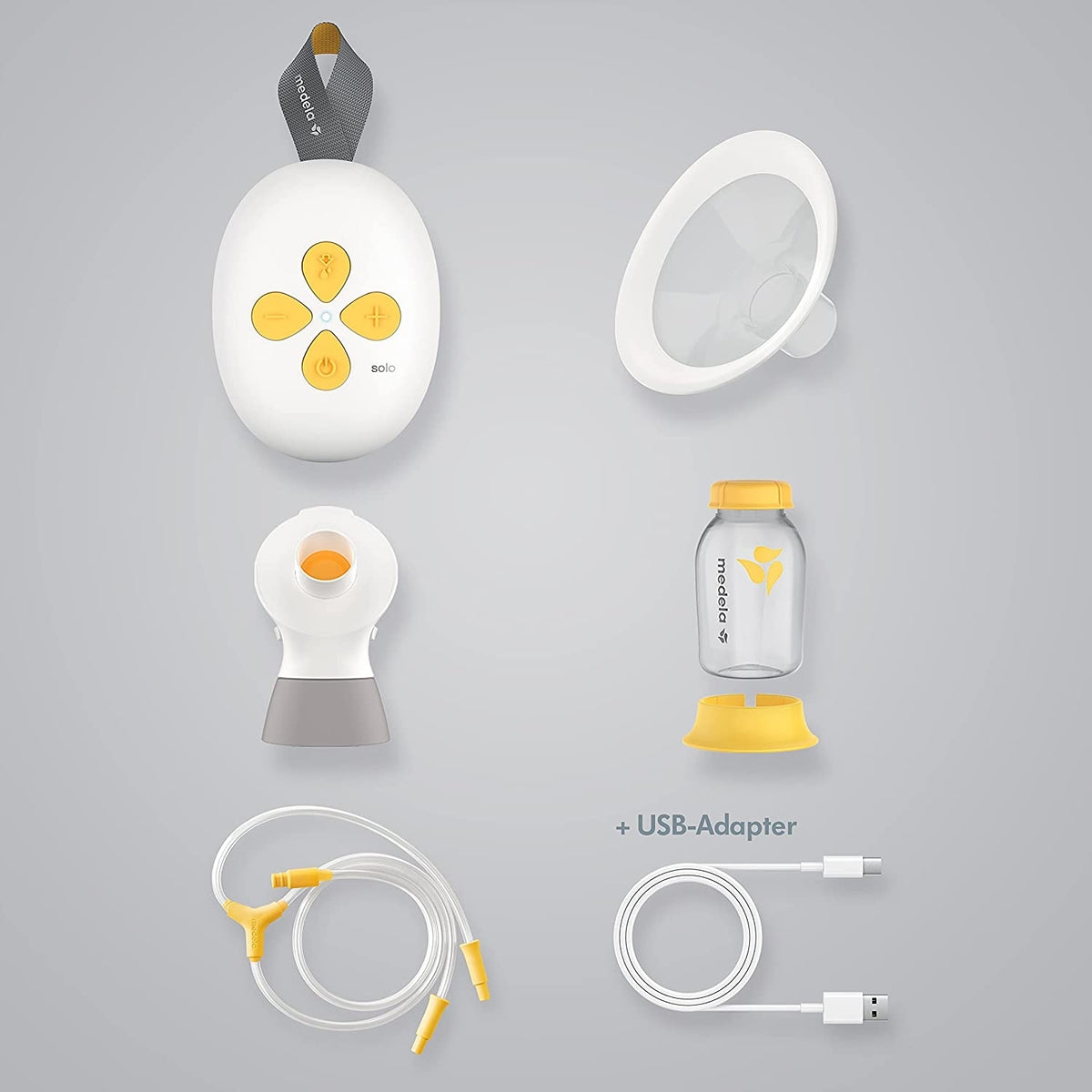 MEDELA SOLO laktator elektryczny 2-fazowy USB, biało-żółty, z akcesoriami i adapterem USB