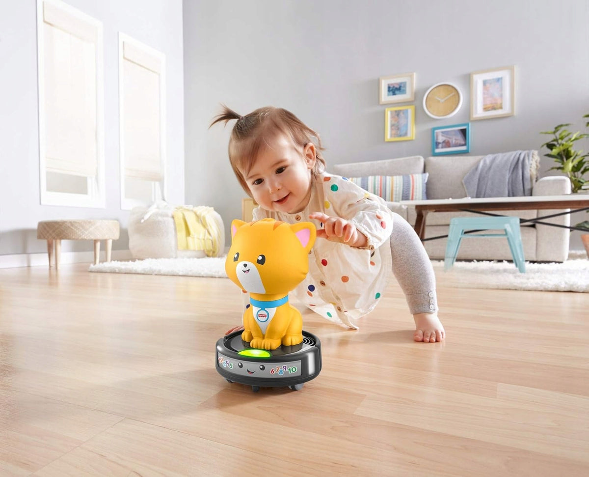 FISHER-PRICE GMX70 chat roulant sur un aspirateur robot avec mélodies et lumières